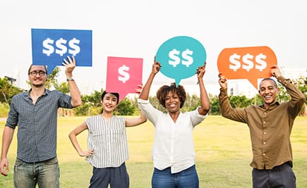 people holding signs with dollar signs